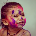 selective focus photography toddler girl with face paint